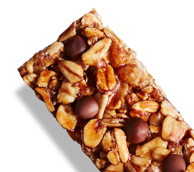 Close up image of a granola bar, detailing oat grains, rice crisps and chocolate chips.