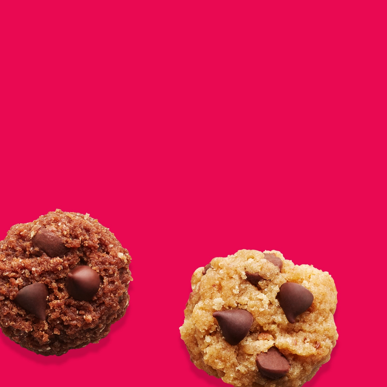 A close up of a chocolate chip and double chocolate soft baked cookies on a fuschia background